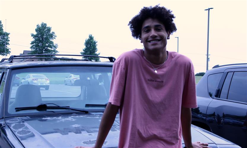 A student smiles